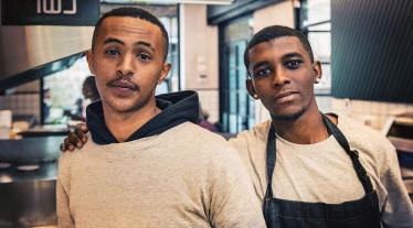 Two men working in a kitchen