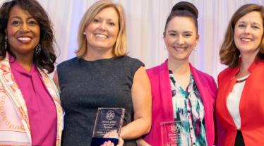 women holding awards