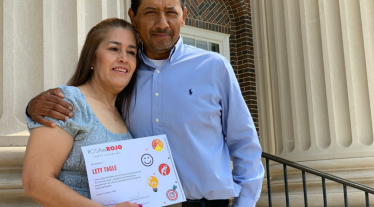 man and woman holding certificate