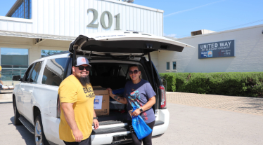 Volunteers from Spartan Carrier Group help distribute A/C units to Tarrant County residents.  